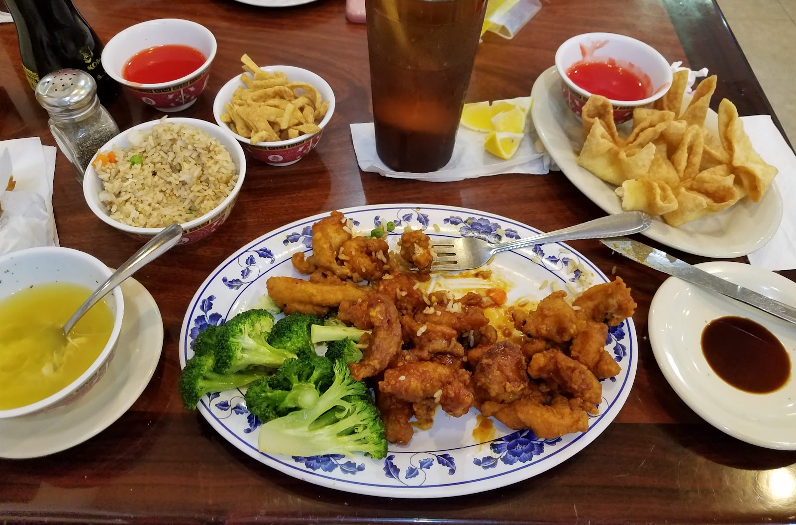 Sesame chicken, egg rolls, and fried rice spread at La Vernia Chinese Cuisine