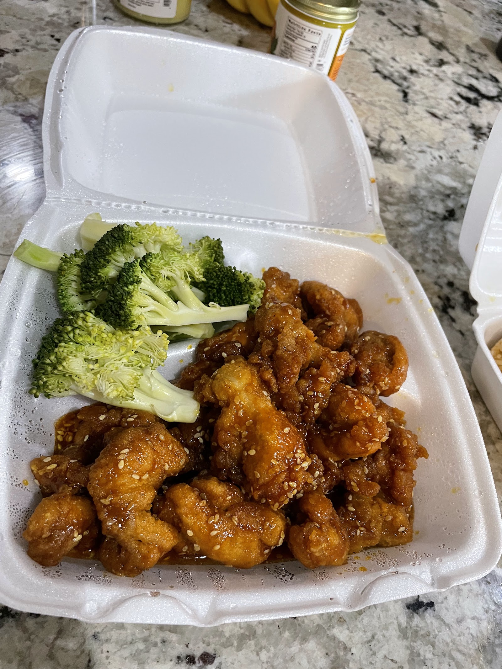 Sesame chicken to-go box with broccoli